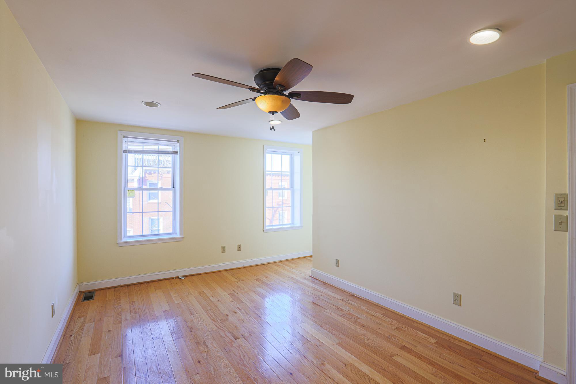 1447 William Street Baltimore, MD 21230 - Photo 55 of 72 a view of an empty room with window and wooden floor
