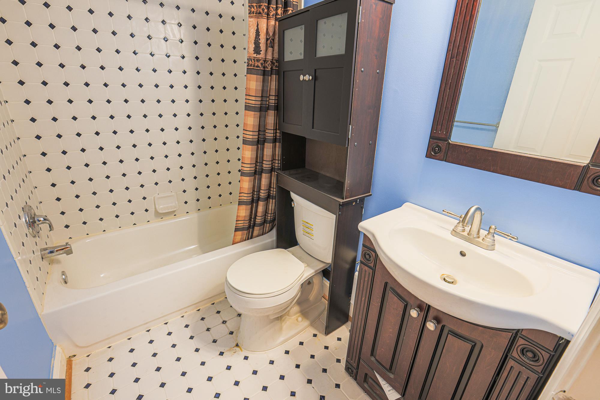 1447 William Street Baltimore, MD 21230 - Photo 70 of 72 a bathroom with a sink toilet and shower