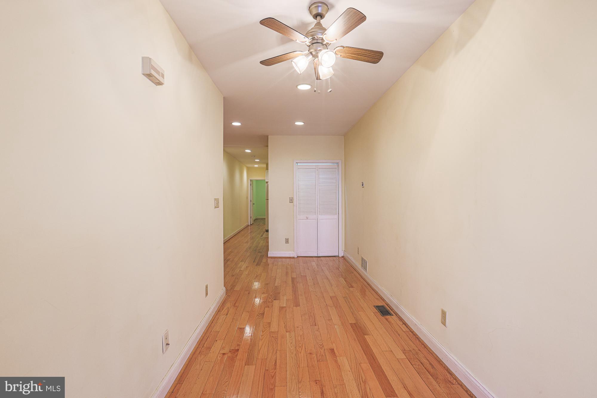 1447 William Street Baltimore, MD 21230 - Photo 8 of 72 a view of a hallway with a chandelier fan