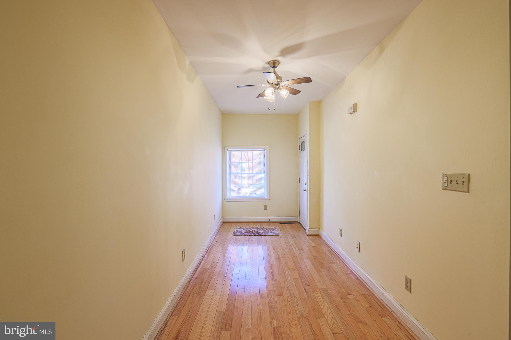1447 William Street Baltimore, MD 21230 - Photo 10 of 72 a view of a hallway with wooden floor