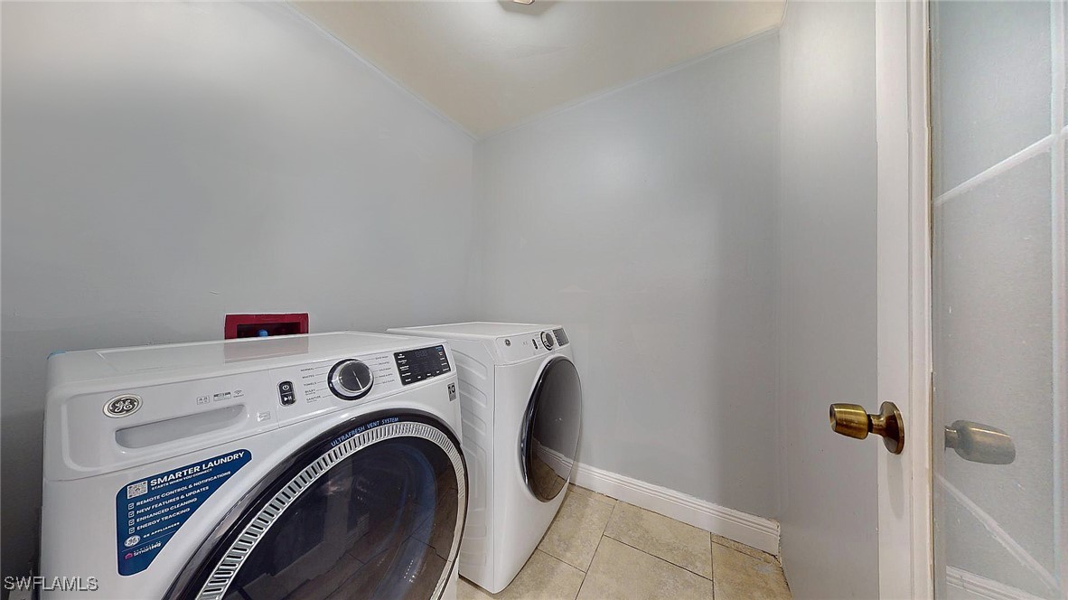 2602 5th Street Southwest Lehigh Acres, FL 33976 - Photo 12 of 17 a utility room with dryer and washer