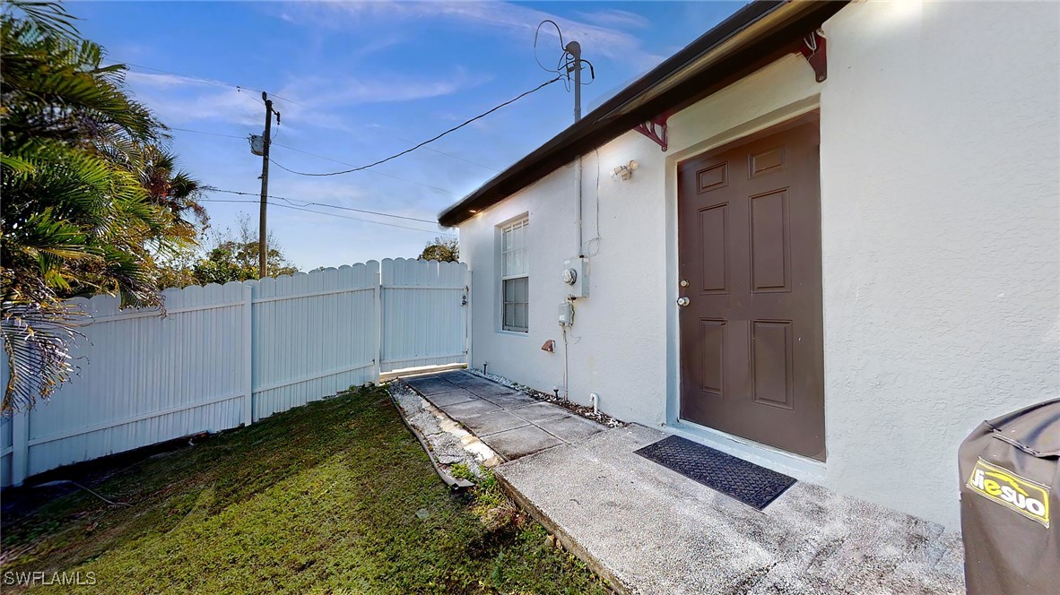 2602 5th Street Southwest Lehigh Acres, FL 33976 - Photo 15 of 17 a backyard of a house