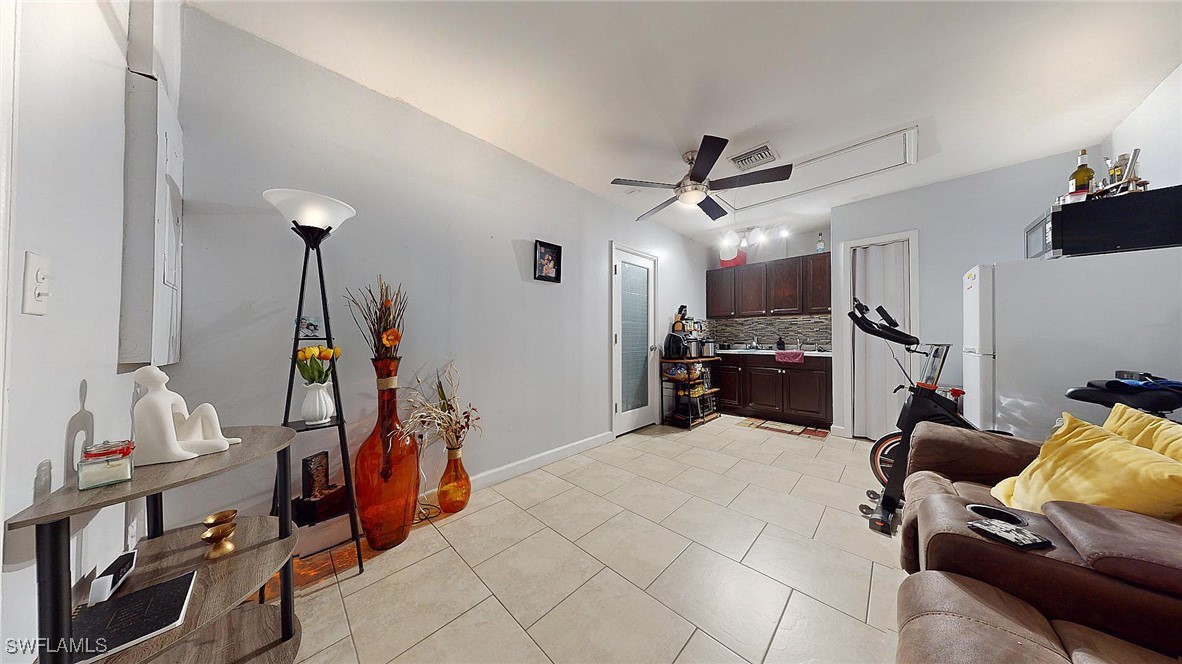 2602 5th Street Southwest Lehigh Acres, FL 33976 - Photo 16 of 17 a bed room with furniture and a window