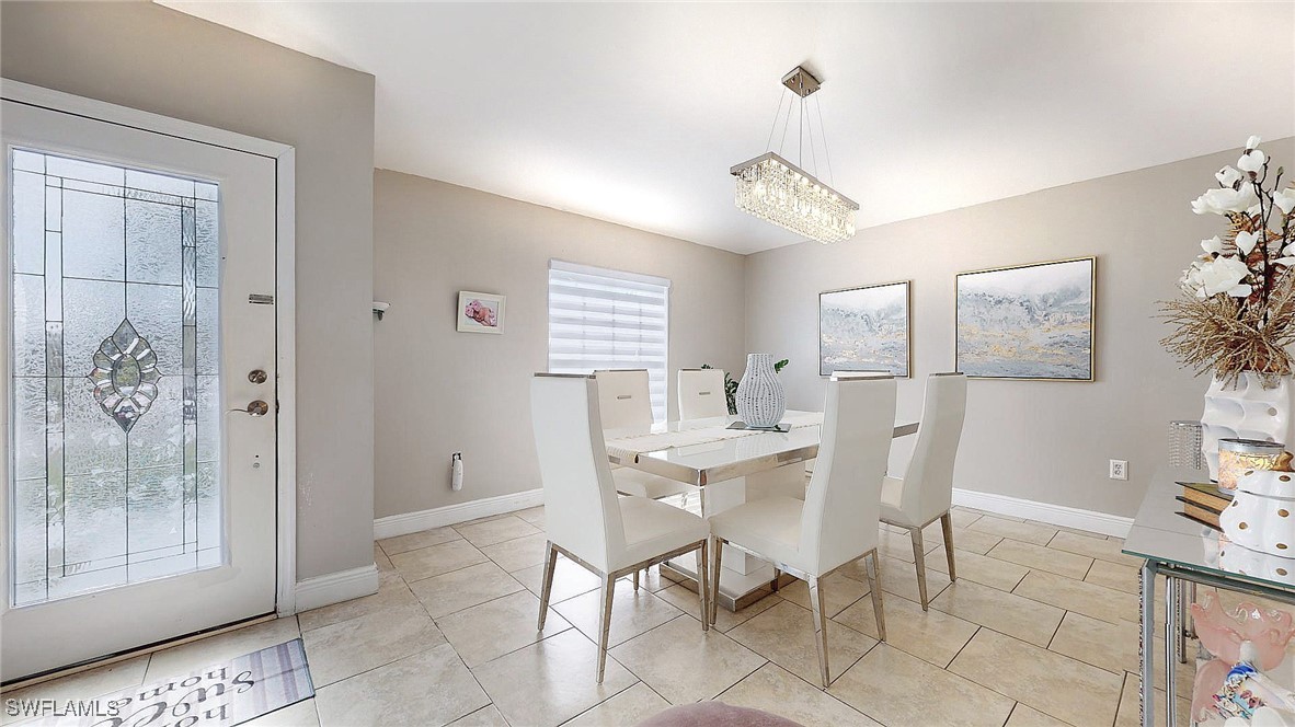 2602 5th Street Southwest Lehigh Acres, FL 33976 - Photo 4 of 17 a view of a dining room with furniture