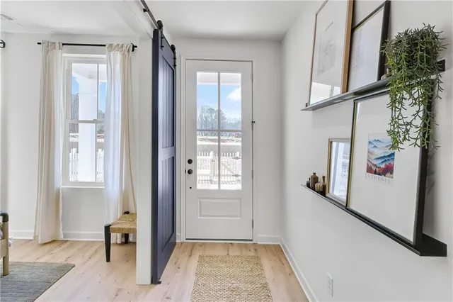 a view of an entryway with front door