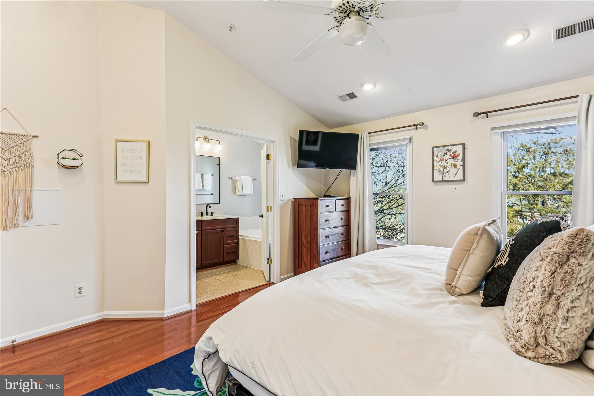 730 Kent Oaks Way Gaithersburg, MD 20878 - Photo 19 of 65 a bedroom with a large bed and a wooden floor