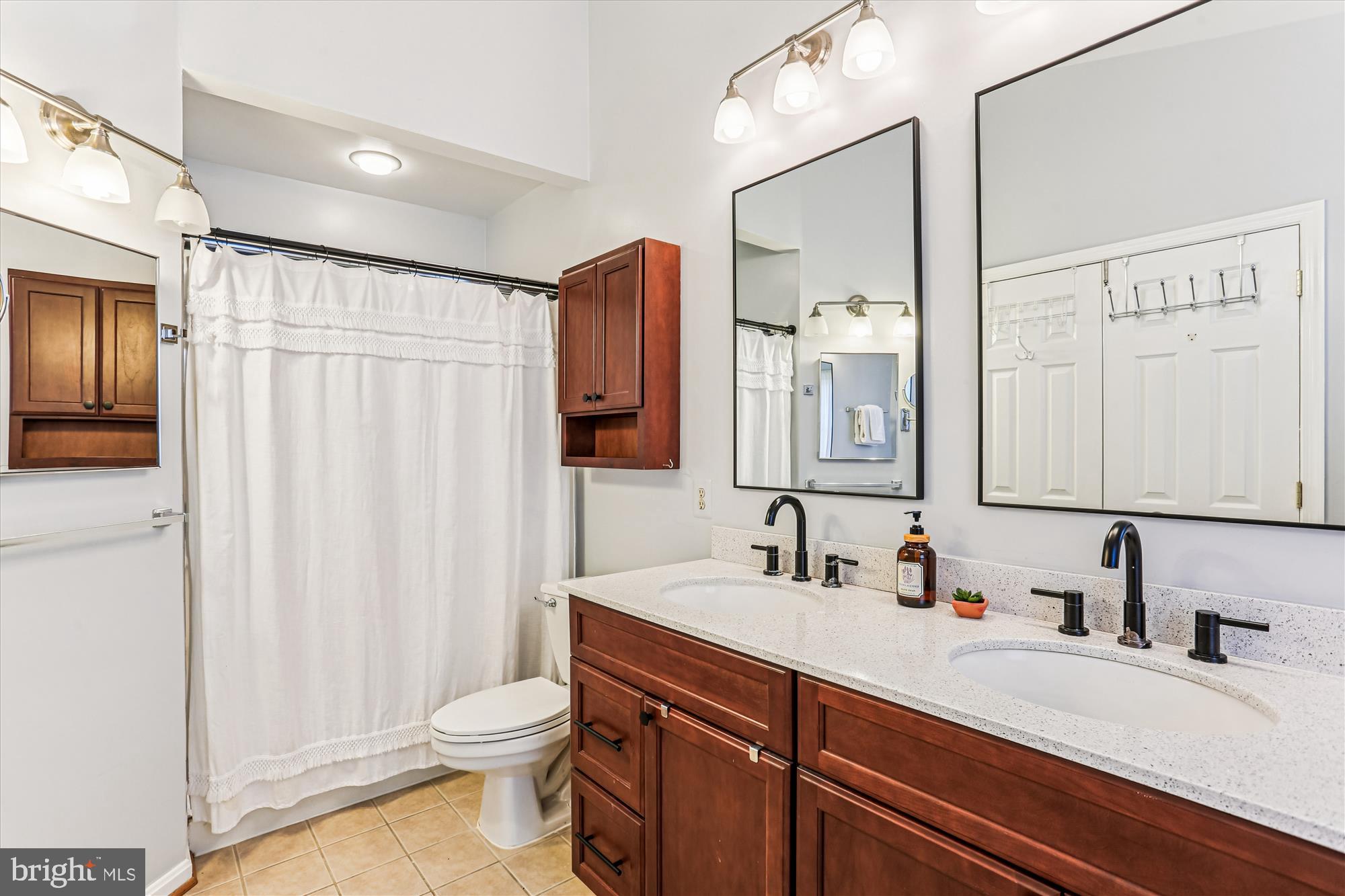 730 Kent Oaks Way Gaithersburg, MD 20878 - Photo 22 of 65 a bathroom with a double vanity sink toilet and a mirror