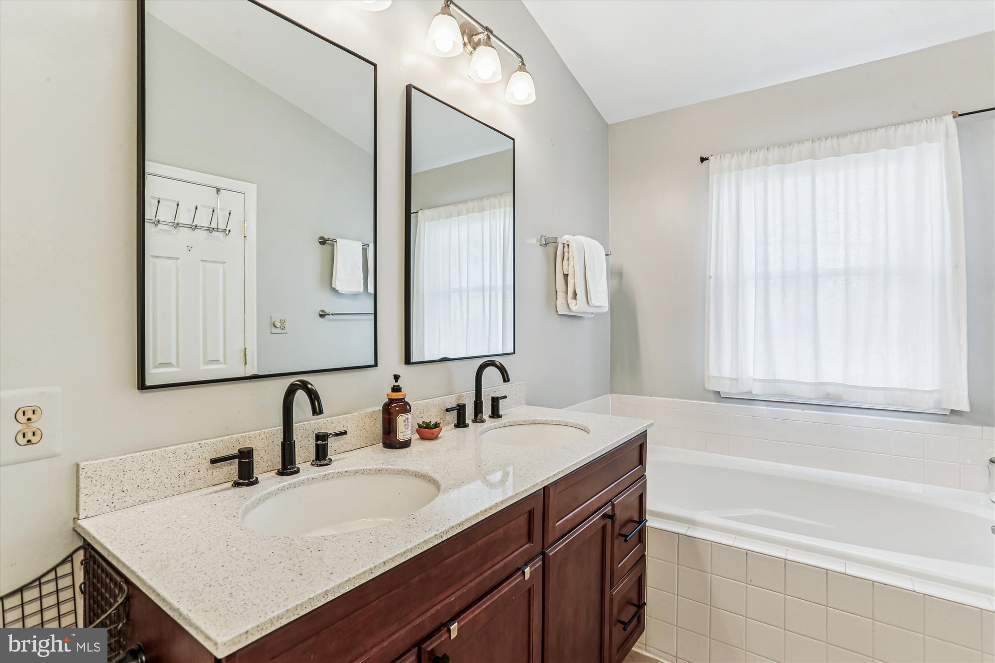 730 Kent Oaks Way Gaithersburg, MD 20878 - Photo 23 of 65 a bathroom with a sink and a bathtub