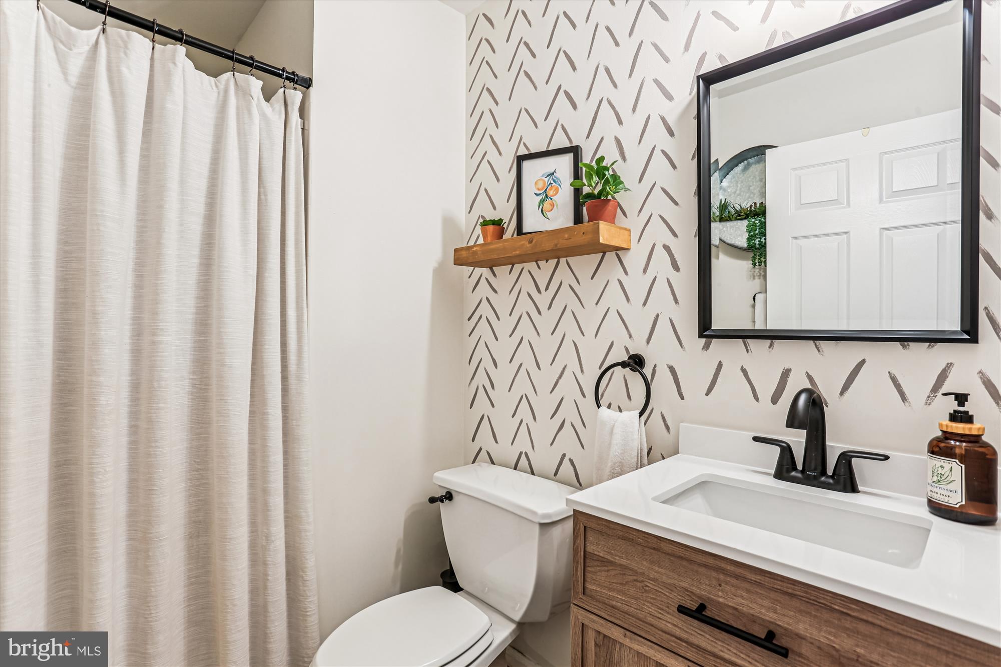 730 Kent Oaks Way Gaithersburg, MD 20878 - Photo 38 of 65 a bathroom with a sink a toilet and a mirror
