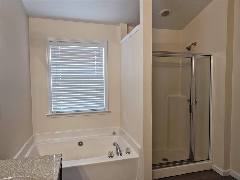 5966 Haddon Place Southeast Mableton, GA 30126 - Photo 21 of 35 a bathroom with a bathtub