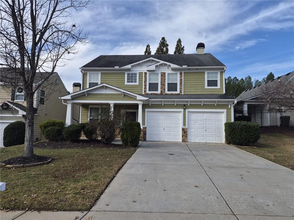 5966 Haddon Place Southeast Mableton, GA 30126 - Photo 35 of 35 a front view of a house with a yard and garage