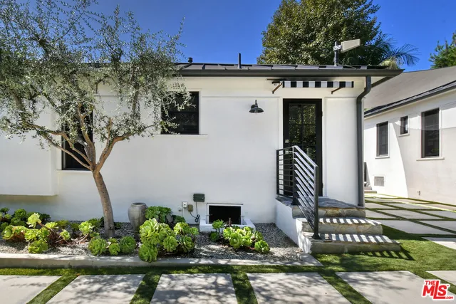 front view of a house with a small yard