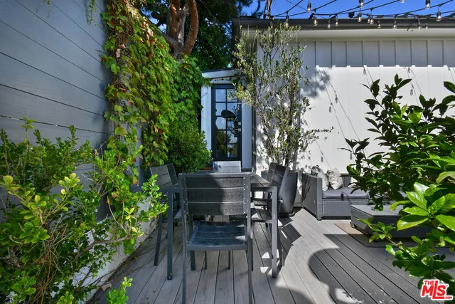 a view of a chairs and table in a patio