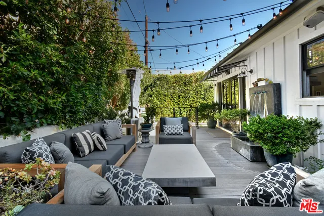 a outdoor living space with furniture and a potted plant