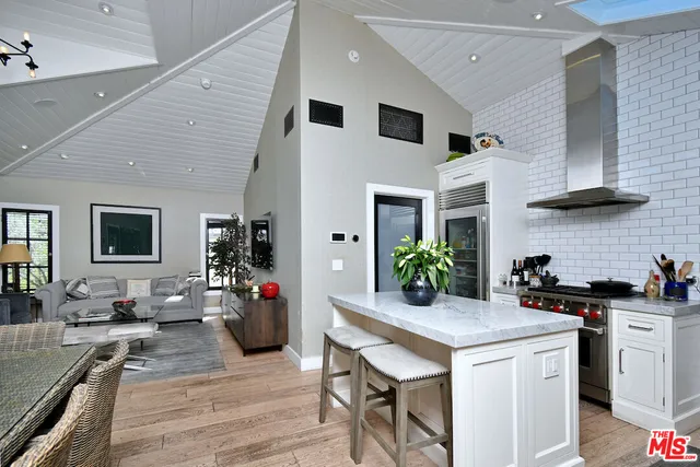 a kitchen with sink and cabinets