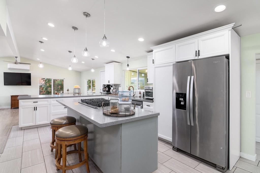 500 Rancheros Drive, Unit 73 San Marcos, CA 92069 - Photo 11 of 52 a kitchen with white cabinets and stainless steel appliances