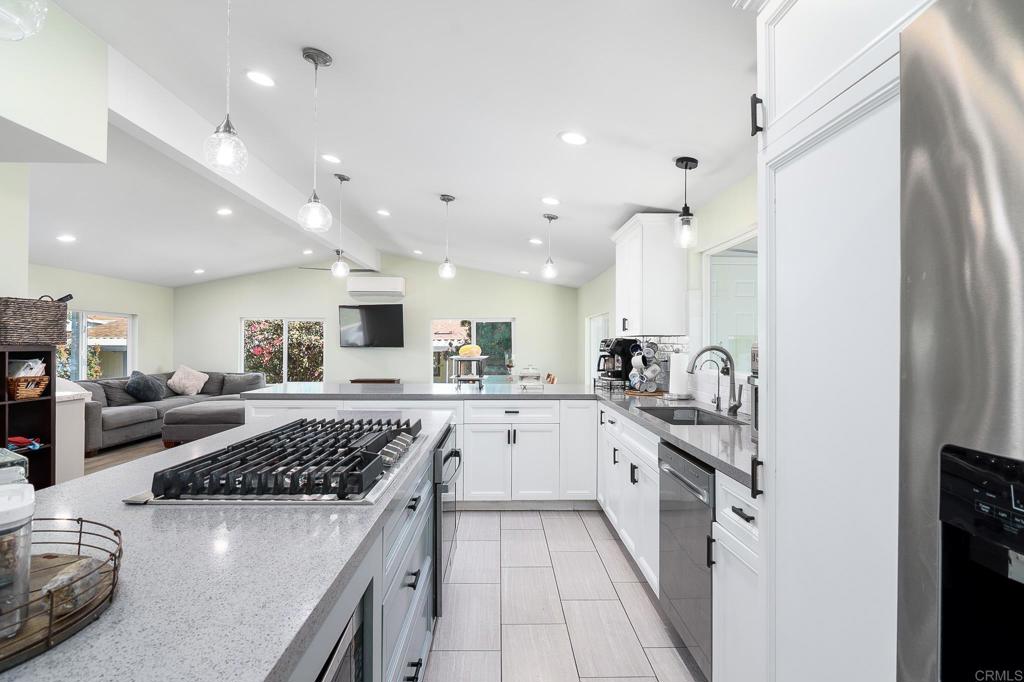 500 Rancheros Drive, Unit 73 San Marcos, CA 92069 - Photo 12 of 52 a kitchen with a sink stove and refrigerator