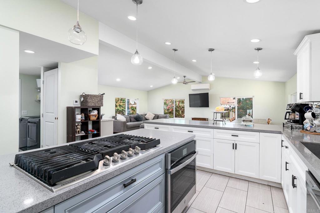 500 Rancheros Drive, Unit 73 San Marcos, CA 92069 - Photo 13 of 52 a kitchen with a stove and cabinets