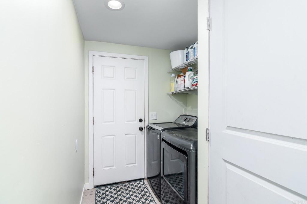 500 Rancheros Drive, Unit 73 San Marcos, CA 92069 - Photo 14 of 52 a utility room with granite countertop a sink and a stove