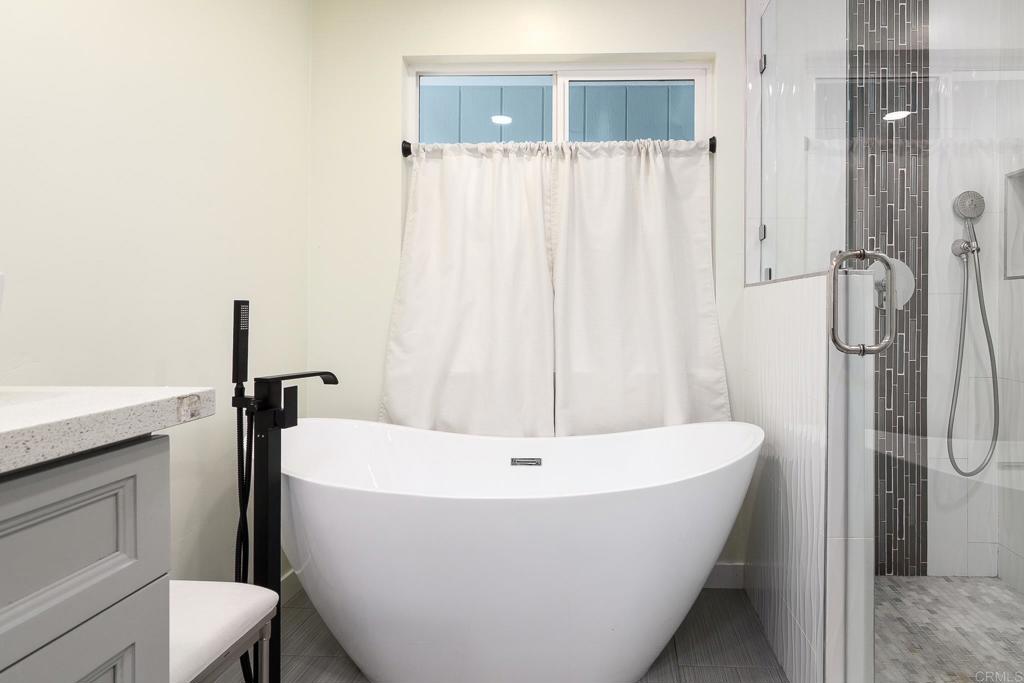 500 Rancheros Drive, Unit 73 San Marcos, CA 92069 - Photo 20 of 52 a white bath tub sitting next to a white sink and toilet