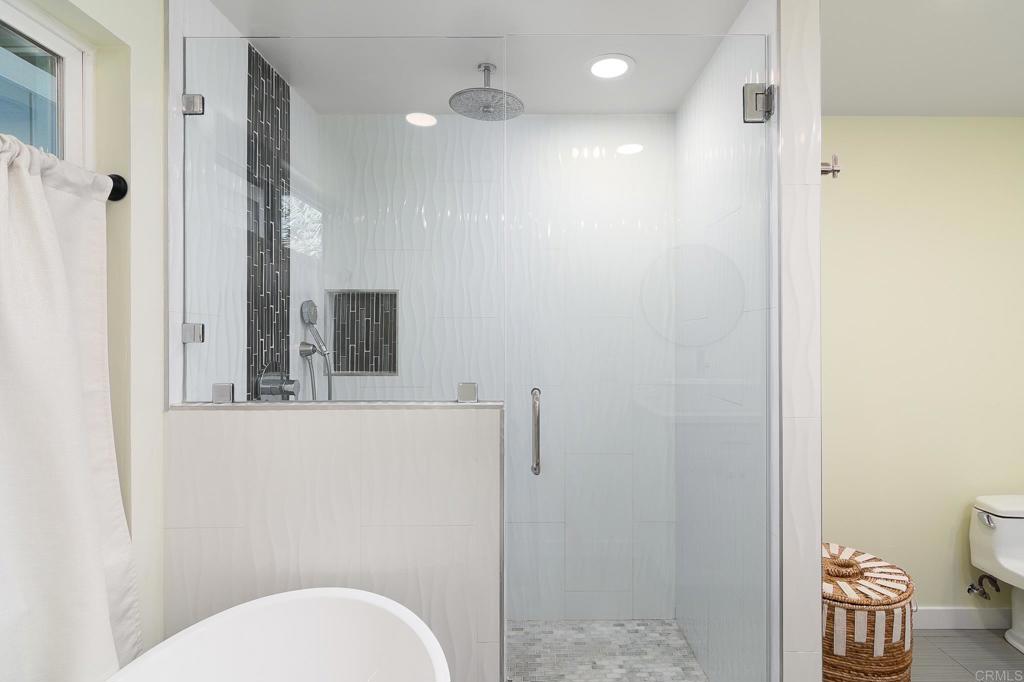 500 Rancheros Drive, Unit 73 San Marcos, CA 92069 - Photo 21 of 52 a bathroom with a toilet a sink and mirror