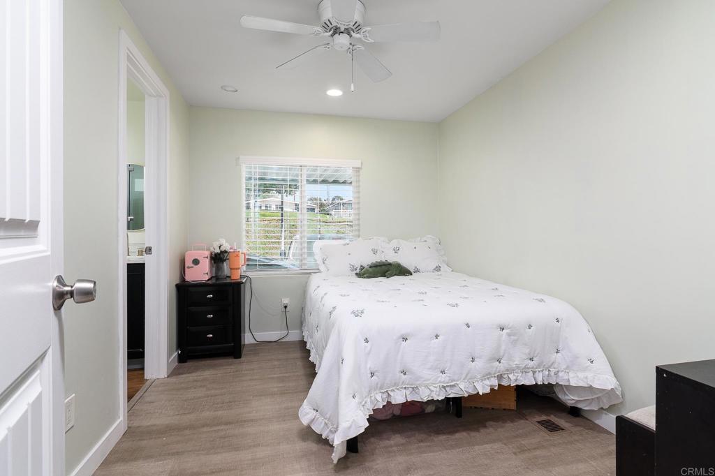 500 Rancheros Drive, Unit 73 San Marcos, CA 92069 - Photo 24 of 52 a bedroom with a bed and a window