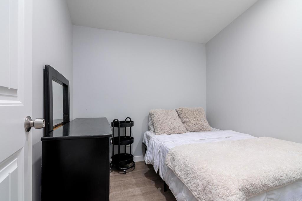 500 Rancheros Drive, Unit 73 San Marcos, CA 92069 - Photo 25 of 52 a bedroom with a bed and a table in it