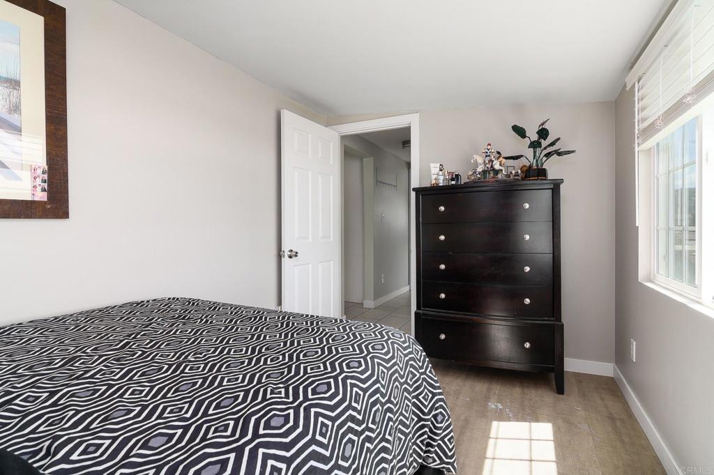 500 Rancheros Drive, Unit 73 San Marcos, CA 92069 - Photo 27 of 52 a bedroom with a bed and a closet