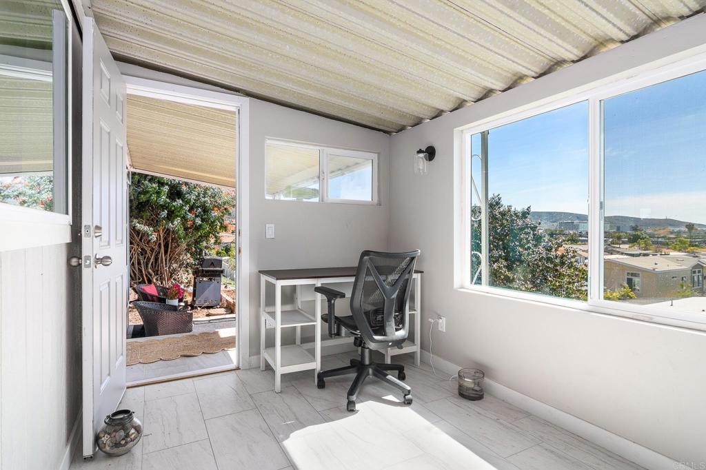 500 Rancheros Drive, Unit 73 San Marcos, CA 92069 - Photo 31 of 52 a work room with a large window and chair
