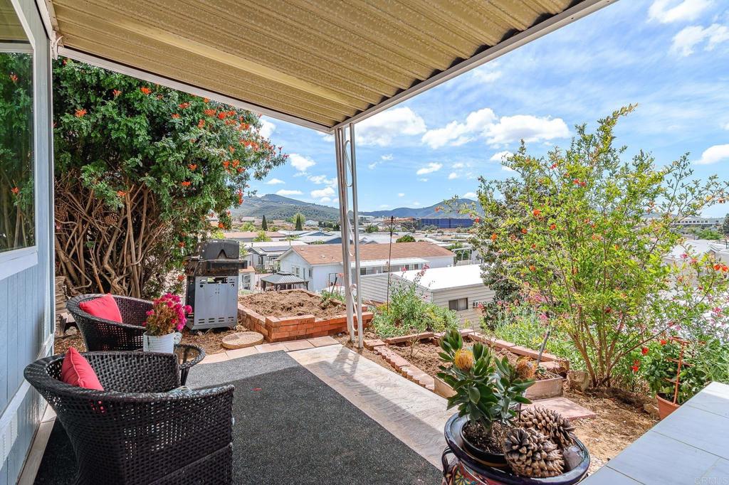 500 Rancheros Drive, Unit 73 San Marcos, CA 92069 - Photo 32 of 52 a outdoor living space with patio furniture and potted plants