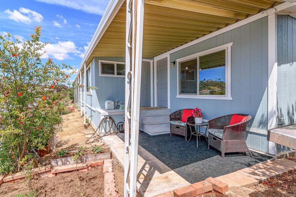 500 Rancheros Drive, Unit 73 San Marcos, CA 92069 - Photo 34 of 52 a sitting area with furniture and wooden floor