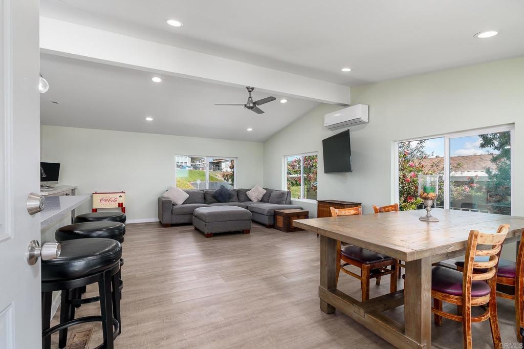500 Rancheros Drive, Unit 73 San Marcos, CA 92069 - Photo 4 of 52 a living room with furniture and a wooden floor