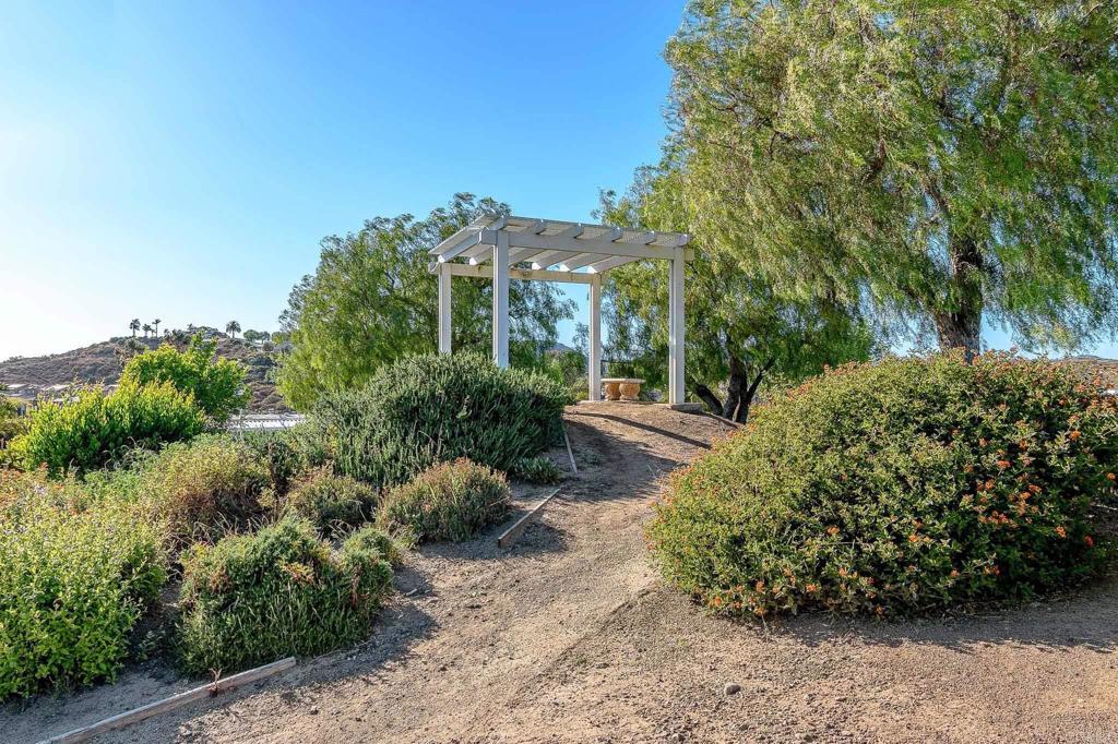 500 Rancheros Drive, Unit 73 San Marcos, CA 92069 - Photo 42 of 52 a view of a garden with a house