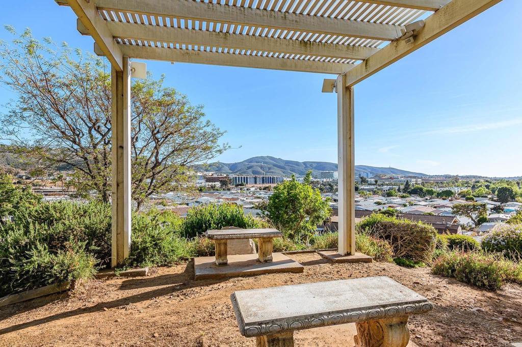 500 Rancheros Drive, Unit 73 San Marcos, CA 92069 - Photo 43 of 52 a view of a patio with a table chairs and a table