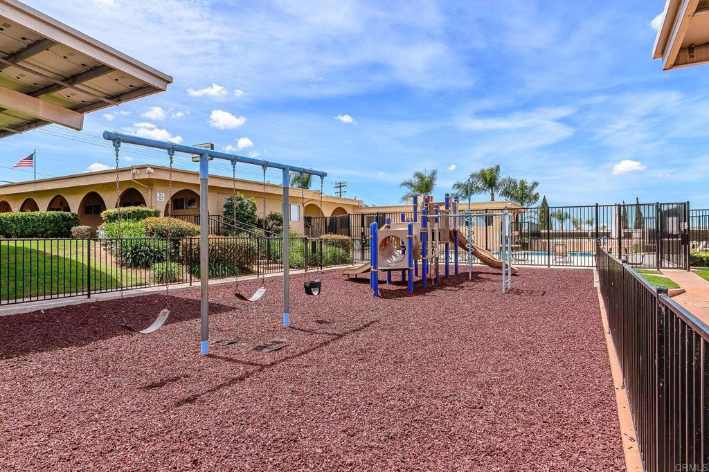 500 Rancheros Drive, Unit 73 San Marcos, CA 92069 - Photo 44 of 52 a view of a swimming pool with a patio and a backyard