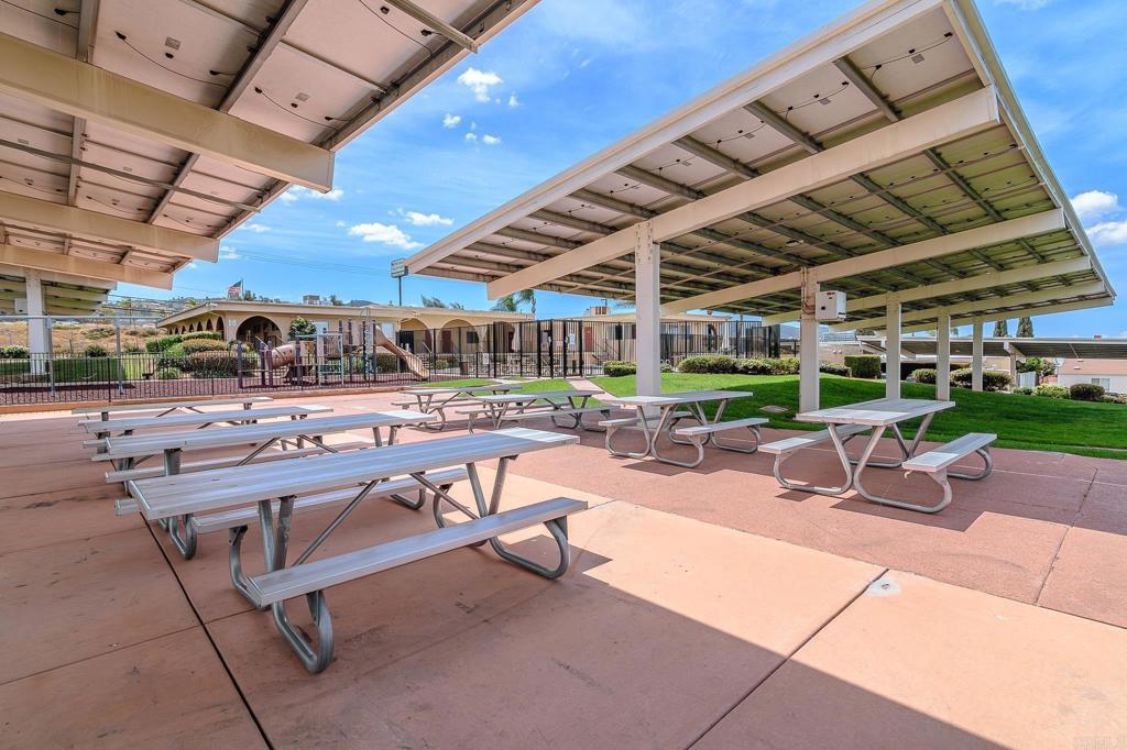 500 Rancheros Drive, Unit 73 San Marcos, CA 92069 - Photo 46 of 52 a view of a swimming pool with outdoor seating
