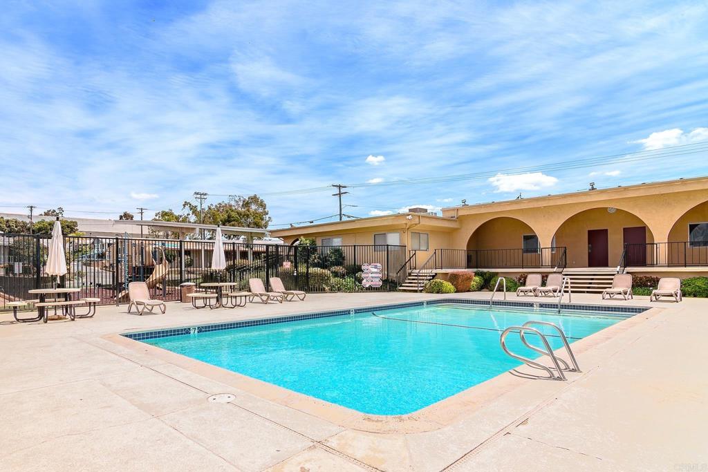 500 Rancheros Drive, Unit 73 San Marcos, CA 92069 - Photo 48 of 52 a view of a swimming pool with outdoor seating