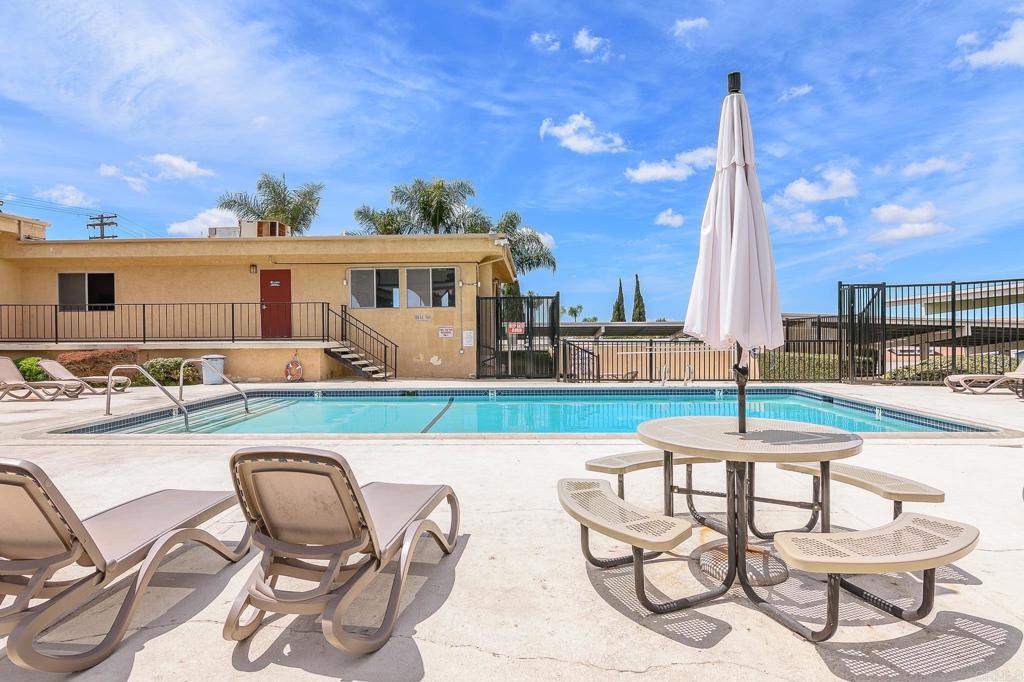 500 Rancheros Drive, Unit 73 San Marcos, CA 92069 - Photo 49 of 52 a swimming pool with outdoor seating and yard