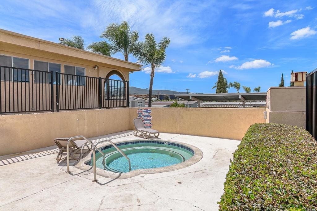 500 Rancheros Drive, Unit 73 San Marcos, CA 92069 - Photo 50 of 52 a view of a swimming pool with a lounge chairs