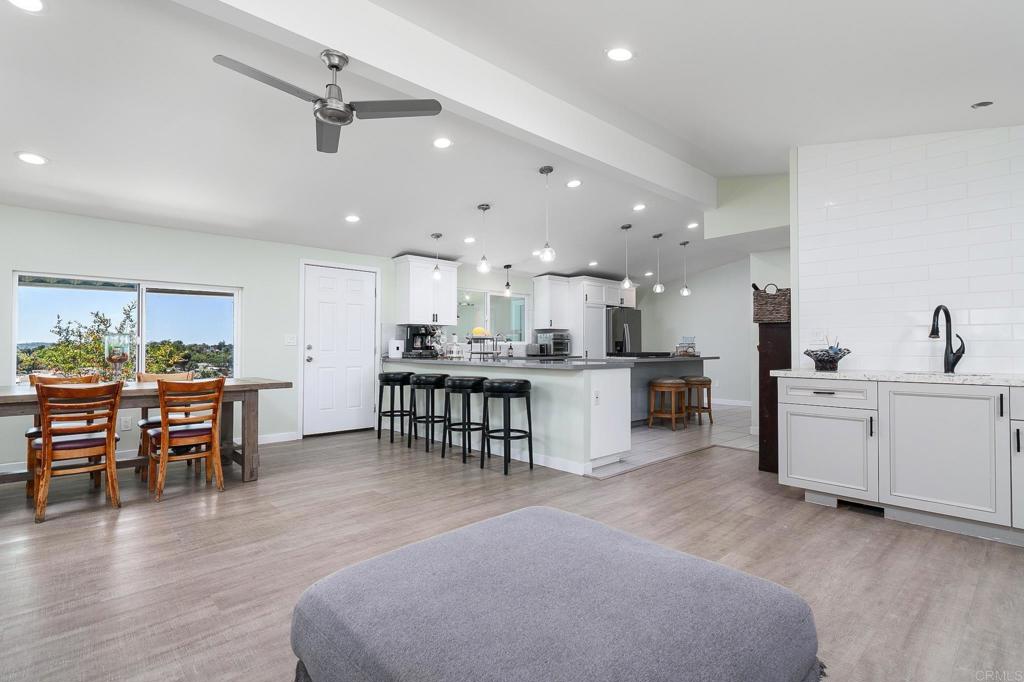 500 Rancheros Drive, Unit 73 San Marcos, CA 92069 - Photo 7 of 52 a open kitchen with white cabinets and stainless steel appliances