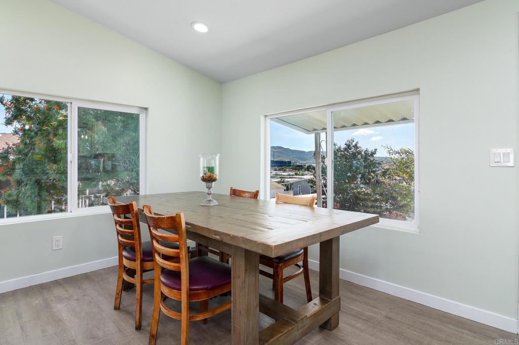 500 Rancheros Drive, Unit 73 San Marcos, CA 92069 - Photo 8 of 52 a view of a dining room with furniture window and wooden floor