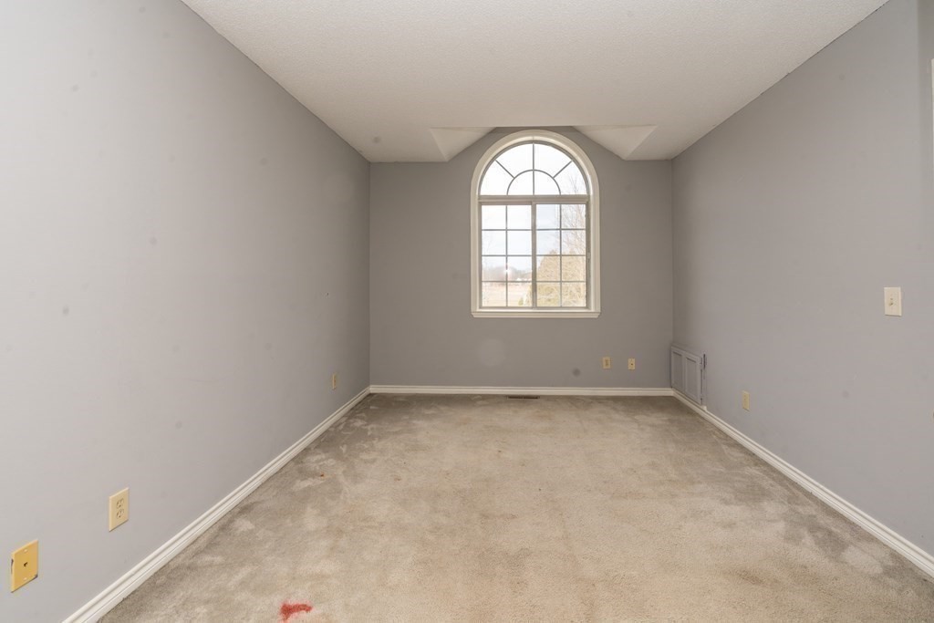104 Johnson Road, Unit 106 Chicopee, MA 01022 - Photo 13 of 24 an empty room with a window