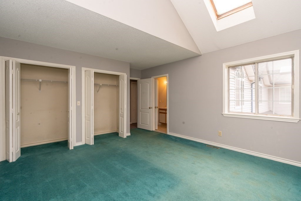 104 Johnson Road, Unit 106 Chicopee, MA 01022 - Photo 15 of 24 an empty room with windows