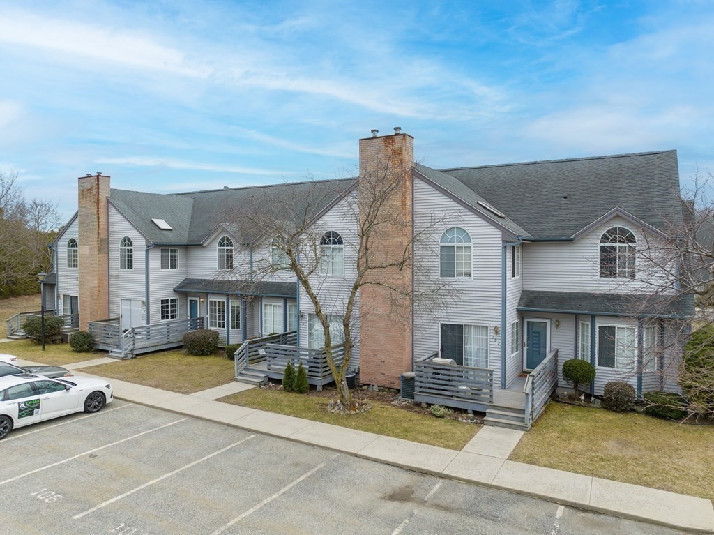 104 Johnson Road, Unit 106 Chicopee, MA 01022 - Photo 2 of 24 a view of a building with many windows
