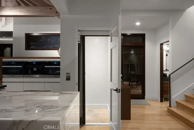 a living room with furniture and potted plant