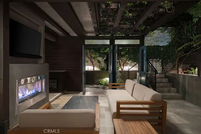 a bathroom with a bathtub a double vanity sink and mirror