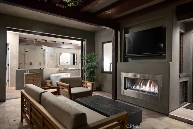a bathroom with a tub sink shower and mirror