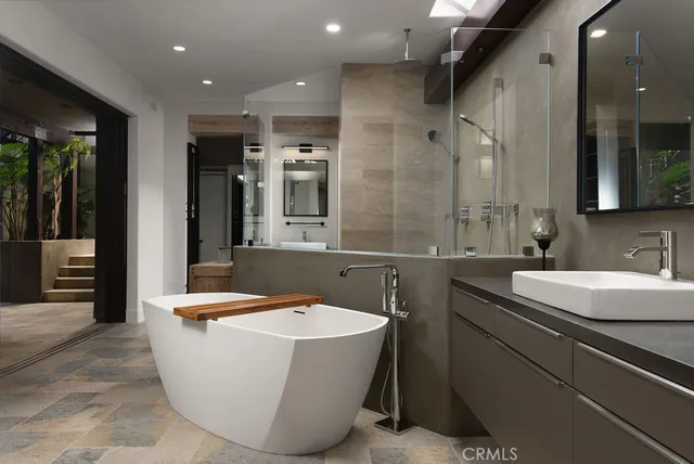 a room with table chairs and a large window