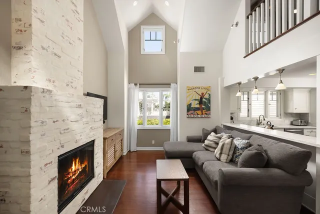 a kitchen with a stove and a wooden floor
