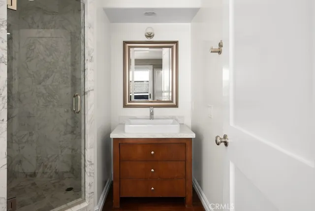 a bathroom with sink and mirror